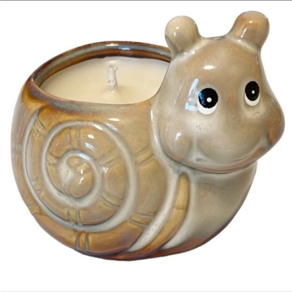 Vintage cottagecore ceramic smiling snail candle